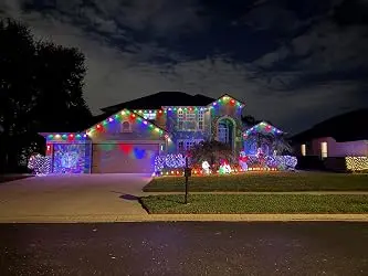 Colourful permanent outdoor lighting on a home
